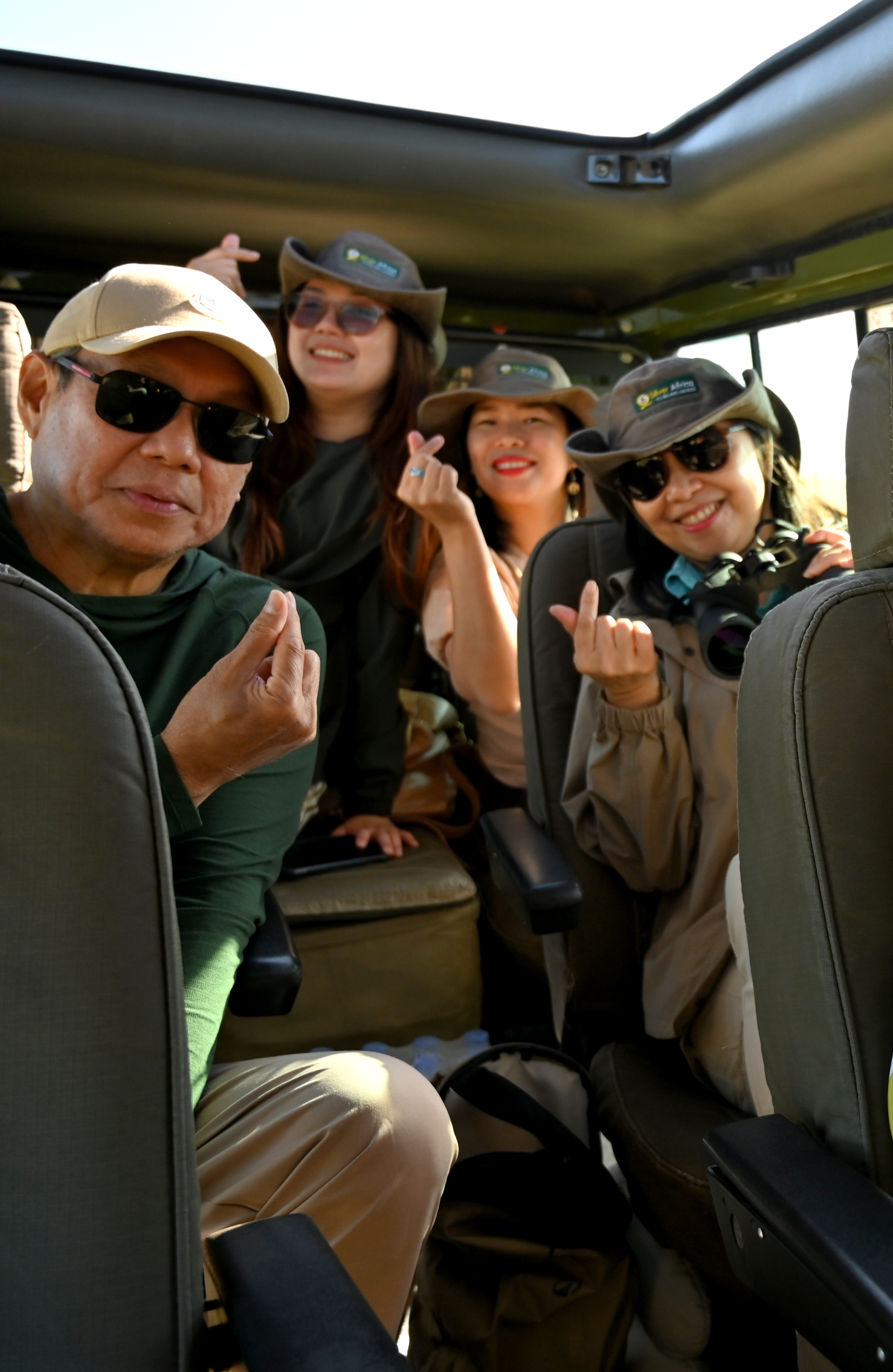 Happy couple enjoying a luxury African safari